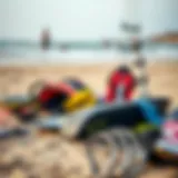 Kitesurfing gear laid out on the beach