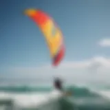 Vibrant kite soaring above the ocean waves