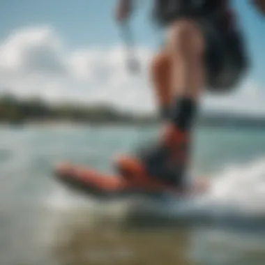 Kitesurfing with Booties on Water A kitesurfer wearing booties while riding the waves.