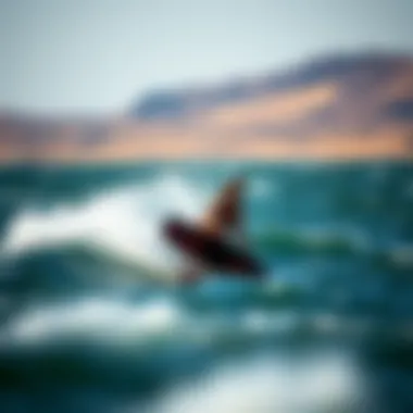 Dynamic Performance on Water A dynamic action shot of a rider on a carbon kiteboard gliding over water.