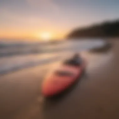 Electric surfboard on the beach at sunset