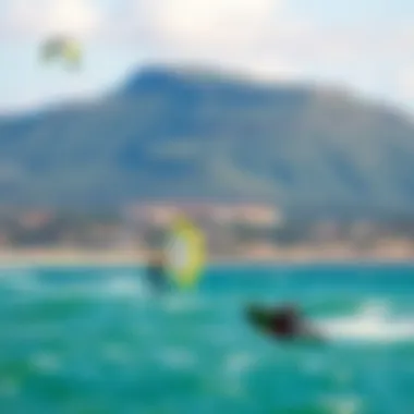 Thrilling Watersports Landscape A scenic beach view with kitesurfers in the background