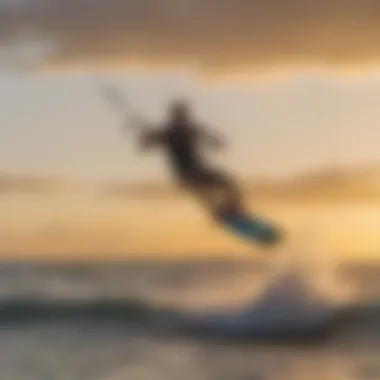 Kiteboarder riding the waves during sunset