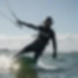 Dynamic kiteboarding action showcasing a rider in a 6mm wetsuit