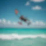 Kiteboarder gliding over turquoise waters