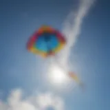 A vibrant kite soaring through a clear blue sky, showcasing its design and colors.