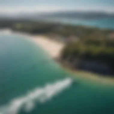 Scenic view of a popular kiteboarding location with multiple kiteboarders