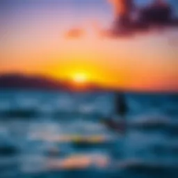 A breathtaking view of kiteboarding at sunset over the ocean