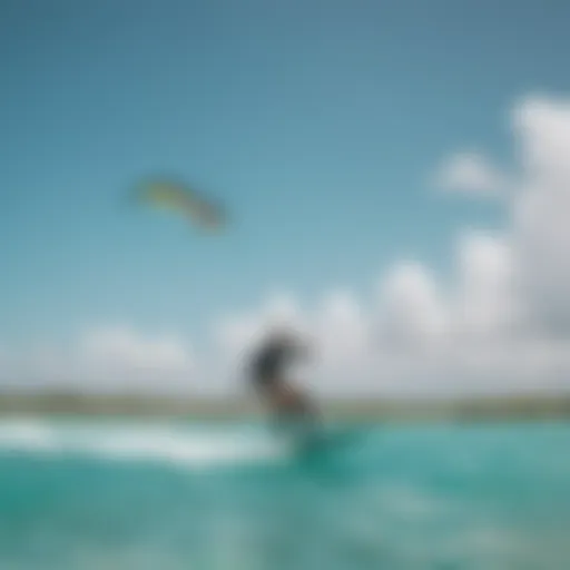 A kite surfer gliding over turquoise waters