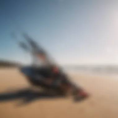 Essential kiteboarding gear displayed on a sandy beach.