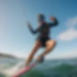 A kiteboarding scene showcasing a vibrant kite against a clear blue sky.