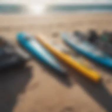 An array of kiteboarding gear laid out on the beach