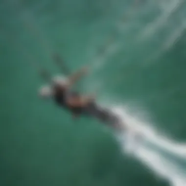 An aerial view of a kiteboarding technique in action.