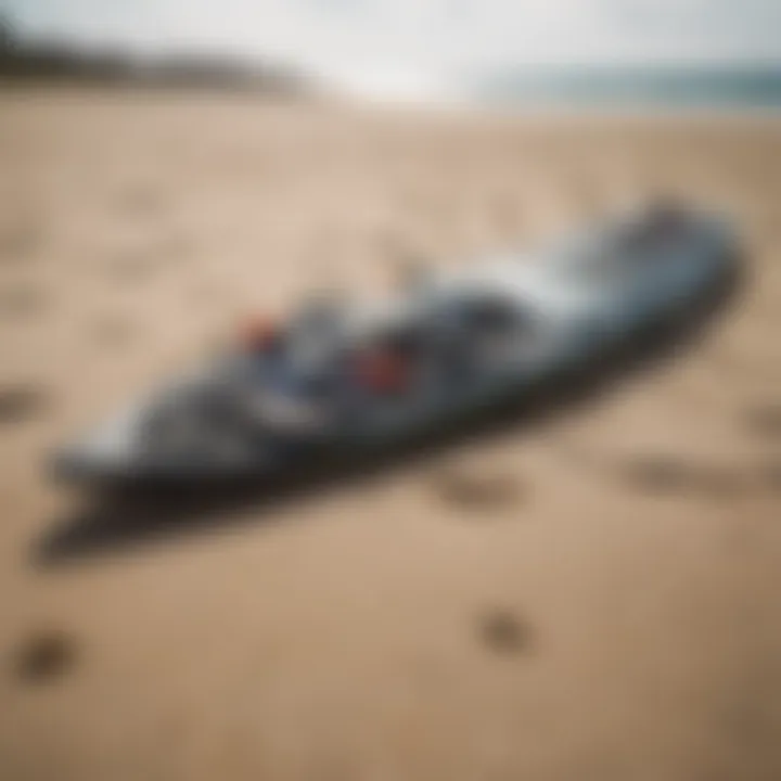 Detailed view of kitesurfing equipment laid out on the beach