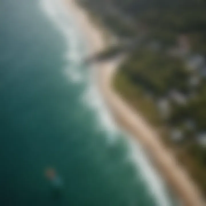 An aerial view of a kiteboarding hotspot, illustrating the interaction between kiteboarders and the expansive ocean.