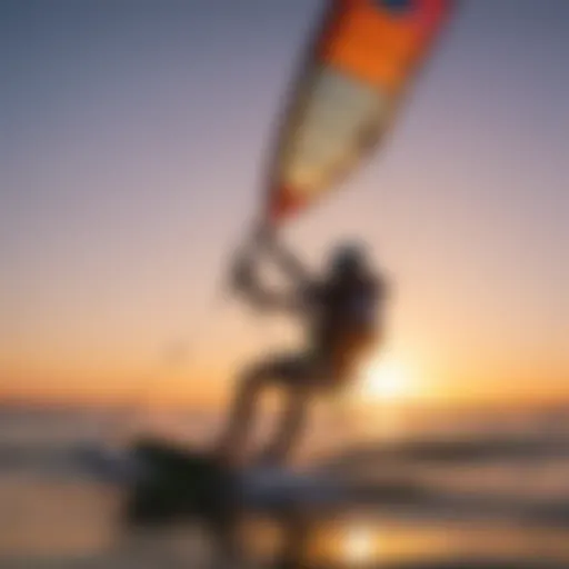 A serene kiteboarding scene at sunset showcasing the vibrant hues of the sky reflecting on the ocean's surface.