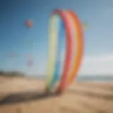 Diverse range of power kites displayed on a sunny beach