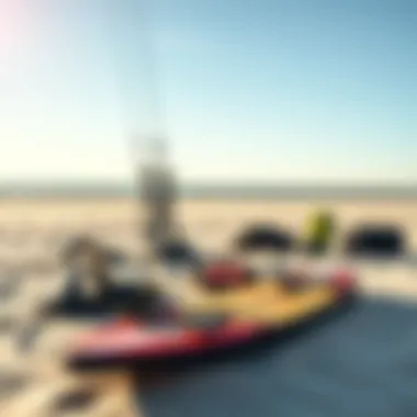 Kiteboarding gear arranged on the sandy shore of Sandbridge
