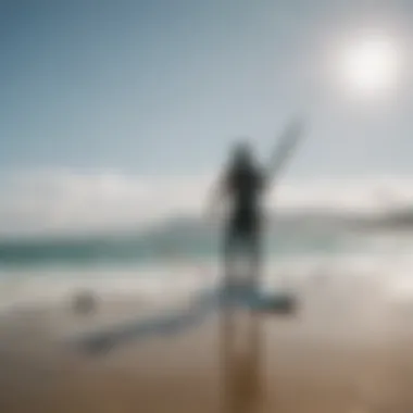 A kiteboarder using a sup inflator adapter at the beach.