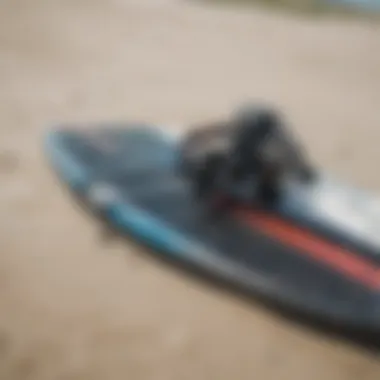 Close-up of kiteboarding gear laid out on the beach