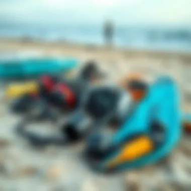 Gear Essentials: Understanding Kiteboarding Equipment Different types of kiteboarding equipment laid out on the beach