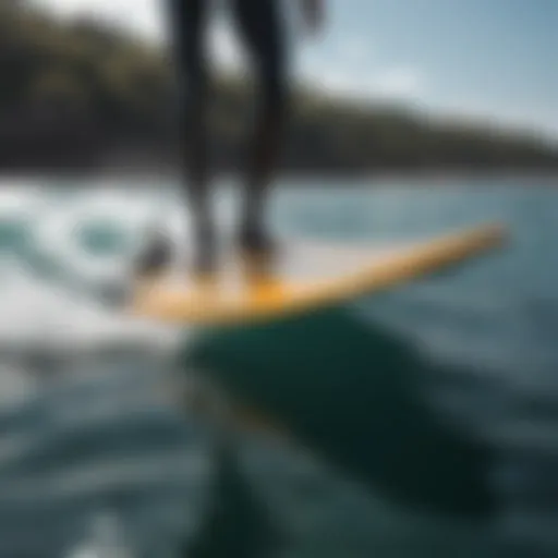 A sleek hydrofoil surfboard gliding above the water surface