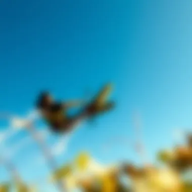 Mastering the Art of Tricks A dynamic action shot of a power kiter performing an impressive trick against a clear blue sky