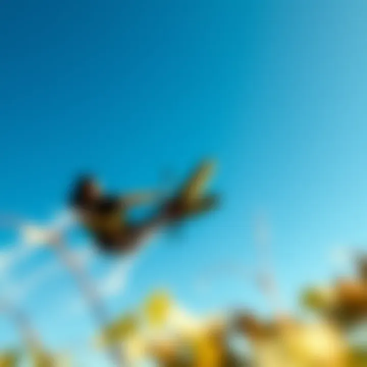 Mastering the Art of Tricks A dynamic action shot of a power kiter performing an impressive trick against a clear blue sky