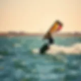 A vibrant wingsurfer gliding across the water with a dynamic pose