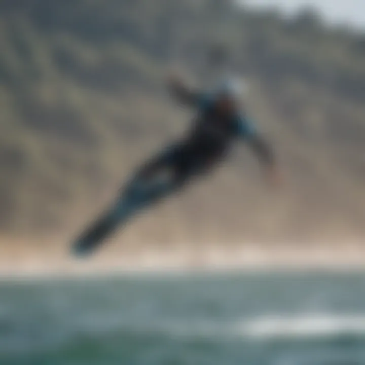 A kiteboarder performing tricks using a mini boom, demonstrating its impact on performance.