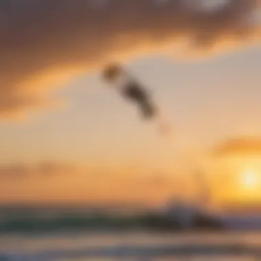 Dynamic kiteboarding action against a vibrant sunset backdrop