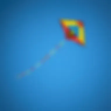 Vibrant Small Kite in Flight A colorful small kite soaring against a clear blue sky