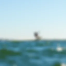 A kite foiler gliding effortlessly over the water's surface.