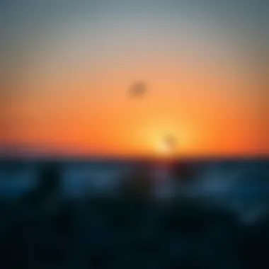 A breathtaking view of a kite foiling location against a sunset.