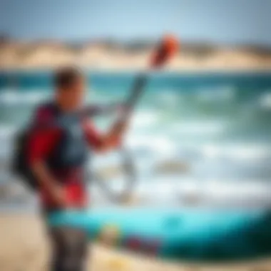 A kiteboarder efficiently using a pump to inflate a kite on the beach.