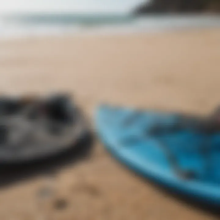 Close-up of essential kite surfing gear laid out on the beach