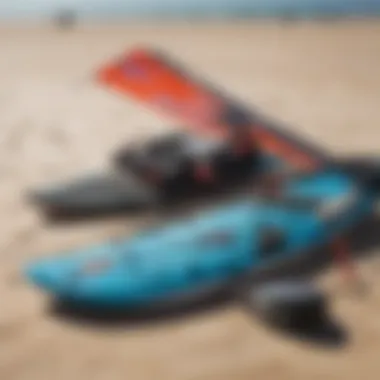 Close-up of kite surfing gear laid out on the sand