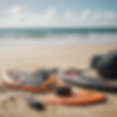 Kite surfing equipment laid out on the sandy beach