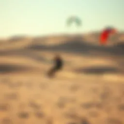 A kiteboarder maneuvering on a sandy terrain with vibrant kites in the sky