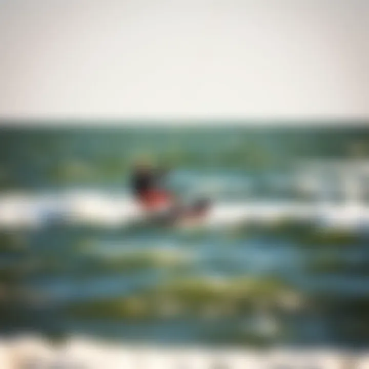 Kiteboarder gliding over the waves