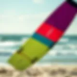 A vibrant kitesurf board on the beach