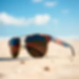 Stylish kitesurfing sunglasses positioned against a vibrant beach background