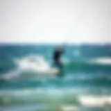 A kite surfer skillfully navigating the waves