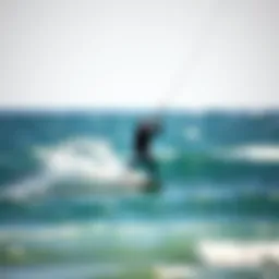A kite surfer skillfully navigating the waves