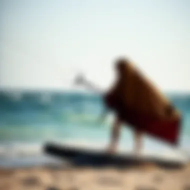 Kiteboarder using the Mystic Towel Poncho on the beach