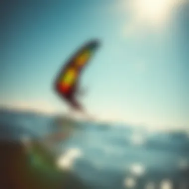 Kiteboarder gliding across the water using the Ocean Rodeo Wing under bright sunny skies.