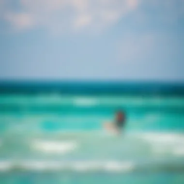 Gliding Over Turquoise Waters Kiteboarder gliding over turquoise waters