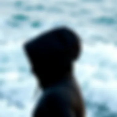 Side view of a Patagonia wetsuit hood against a backdrop of ocean waves