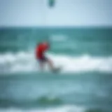 A surfer skillfully maneuvering on the waves while kite surfing