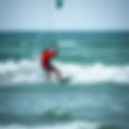A surfer skillfully maneuvering on the waves while kite surfing